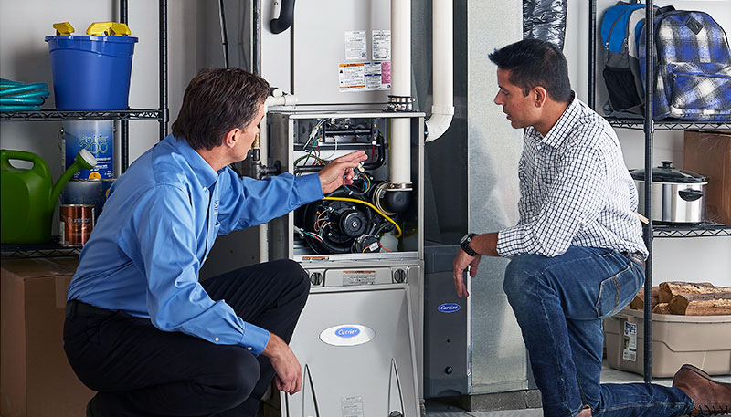 Technician evaluating a furnace for repair or replacement in Santa Clarita