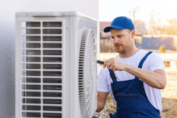HVAC technician servicing an outdoor air conditioner in Santa Clarita