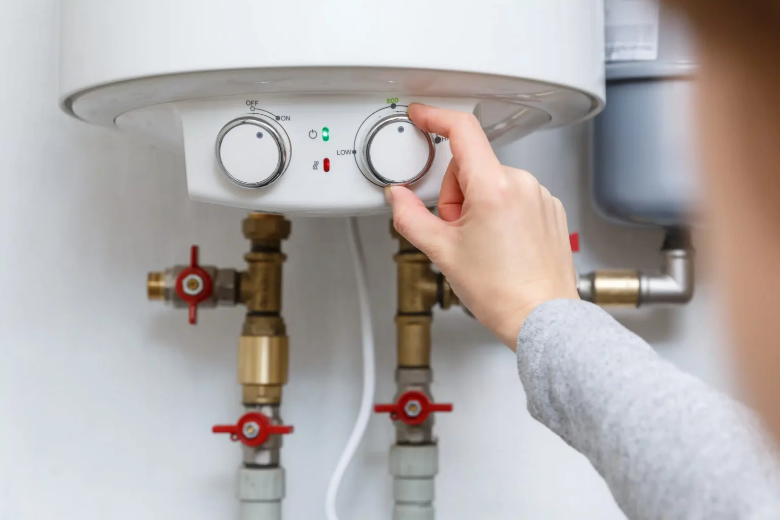 Technician adjusting a water heater in Santa Clarita
